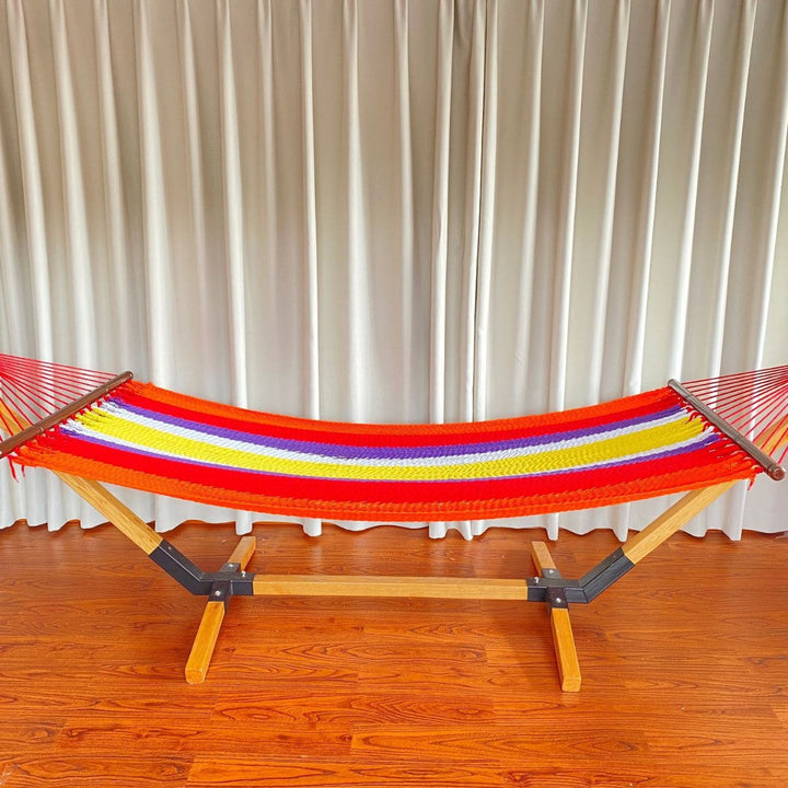 Woven cotton hammock with wooden spreader bars and freestanding stand Stornfield