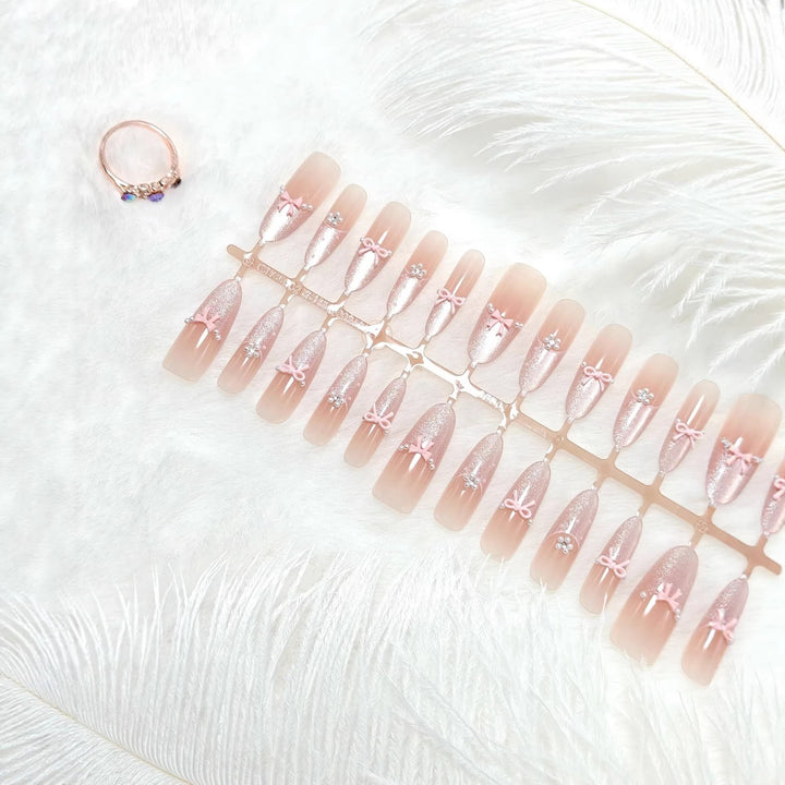 Artificial nails with elegant glitter and bow design Stornfield