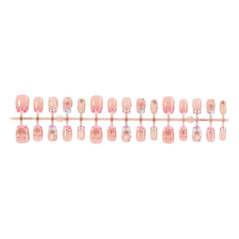 Artificial nail set with floral accents and glamorous decorations Stornfield
