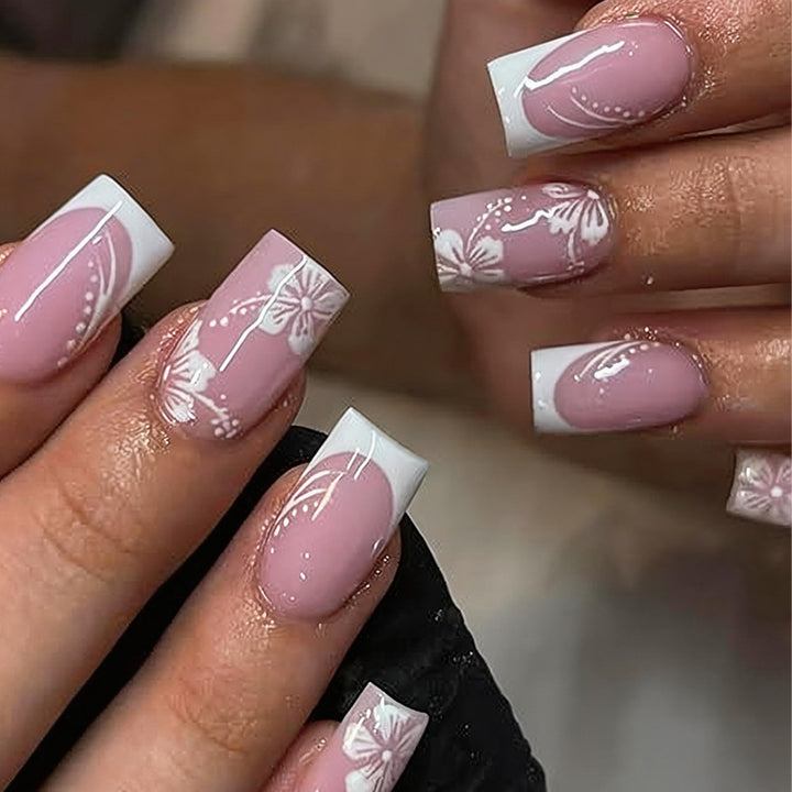 Artificial nail set with elegant French design and delicate flower patterns Stornfield