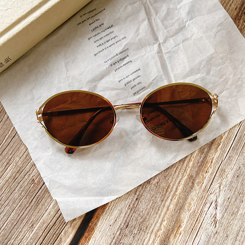 Round Sunglasses with Golden Accents Stornfield