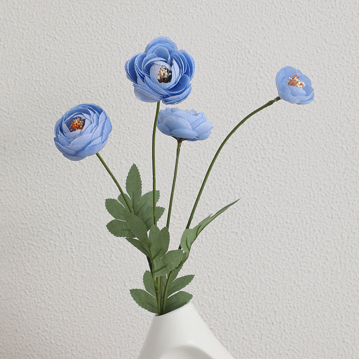Decorative artificial flower bouquet with intricately detailed ranunculus