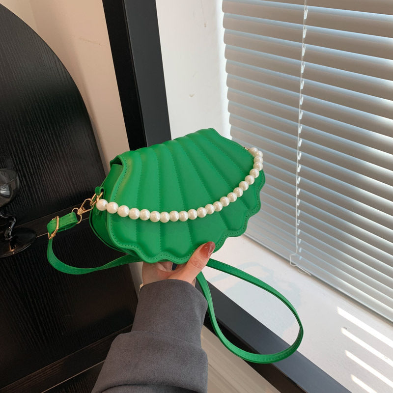 Elegant Pearl-Handled Clutch