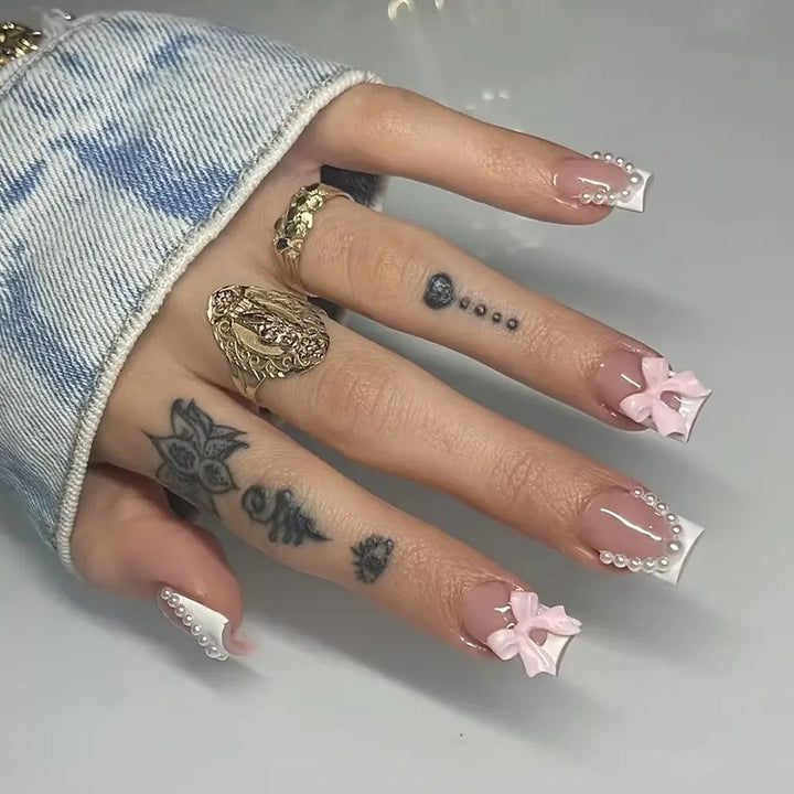 Artificial nail tips with elegant bows and pearl decorations Stornfield