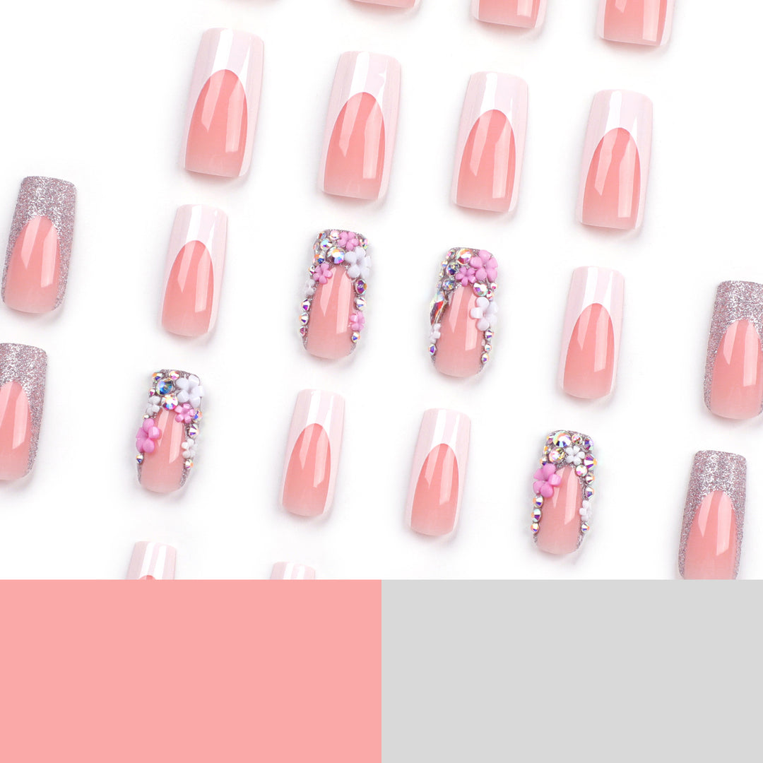 Artificial nails with floral decorations and glitter effects Stornfield