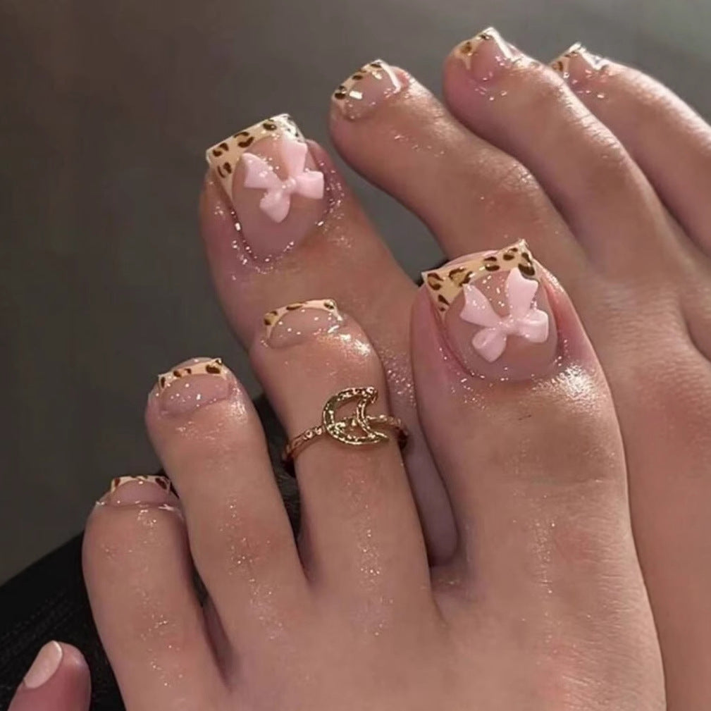 Nail art set with vibrant bow design and trendy leopard pattern Stornfield