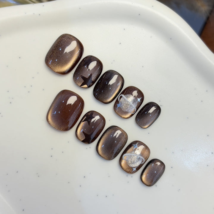 Artificial nail set with star and planet design Stornfield