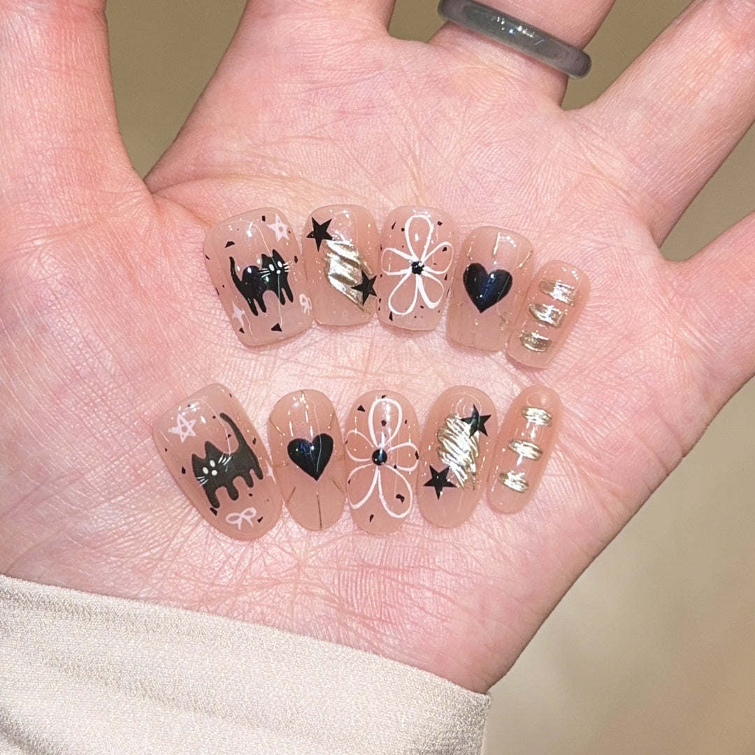 Artificial nails with unique cat and star design Stornfield