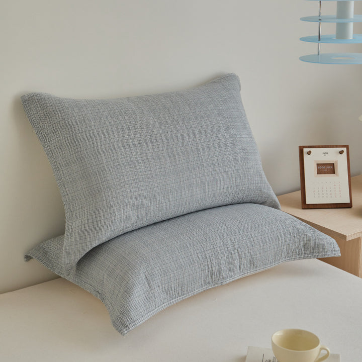 Textured cushion cover set made of cotton-linen blend with waffle structure