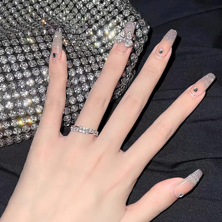 Glamorous artificial nails with sparkling elements