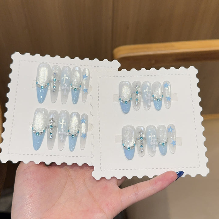 Glamorous artificial nails with rhinestones and stars Stornfield