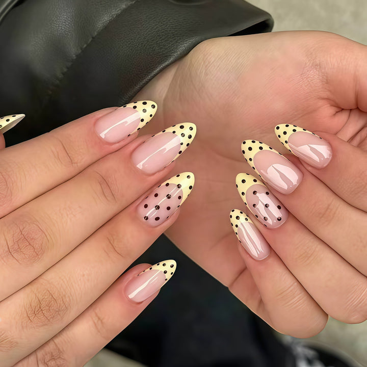 Elegant French Tip Nail Enhancements with Polka Dot Design Stornfield