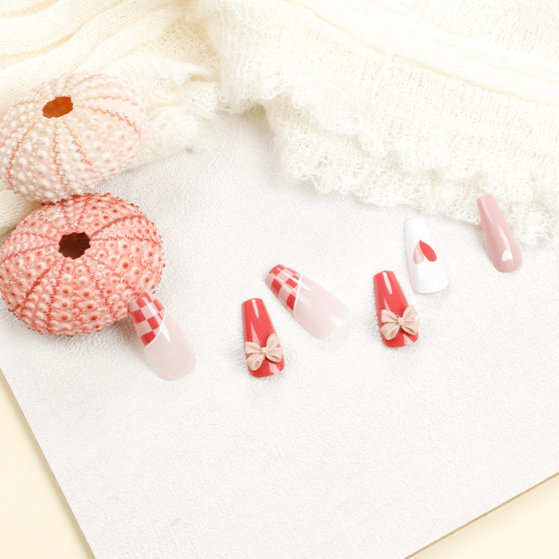 Artful nail extensions with playful designs and romantic accents Stornfield