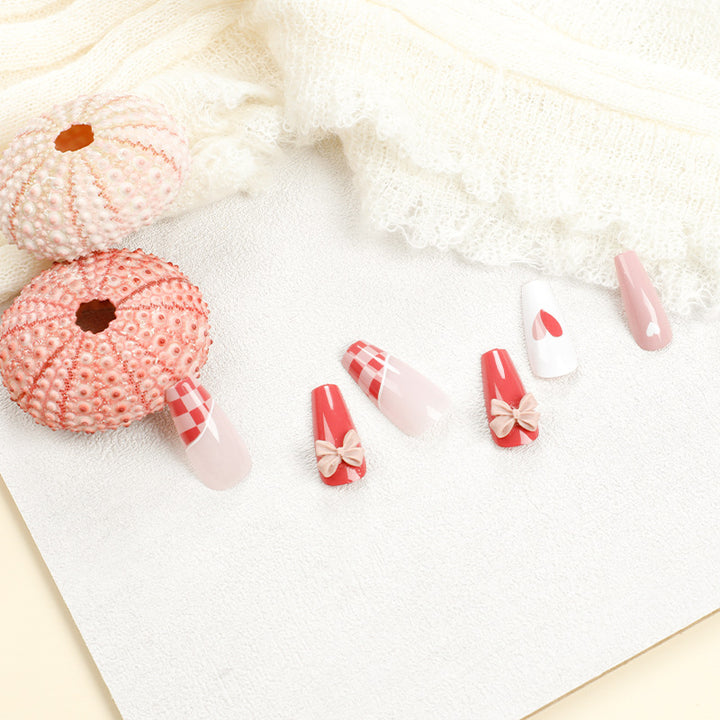 Artful nail extensions with playful designs and romantic accents Stornfield