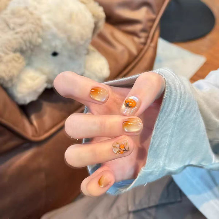 Artificial nails with elegant ombre effect and floral accents Stornfield
