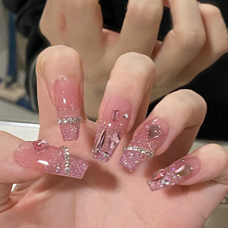 Artificial nails with heart design and glitter accents Stornfield