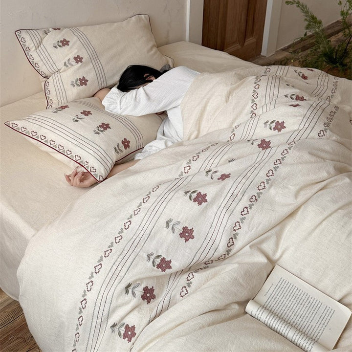 Cotton-linen bedding set with embroidered floral border decor Stornfield