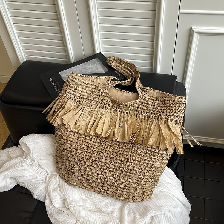 Elegant straw bag with fringed accents Stornfield