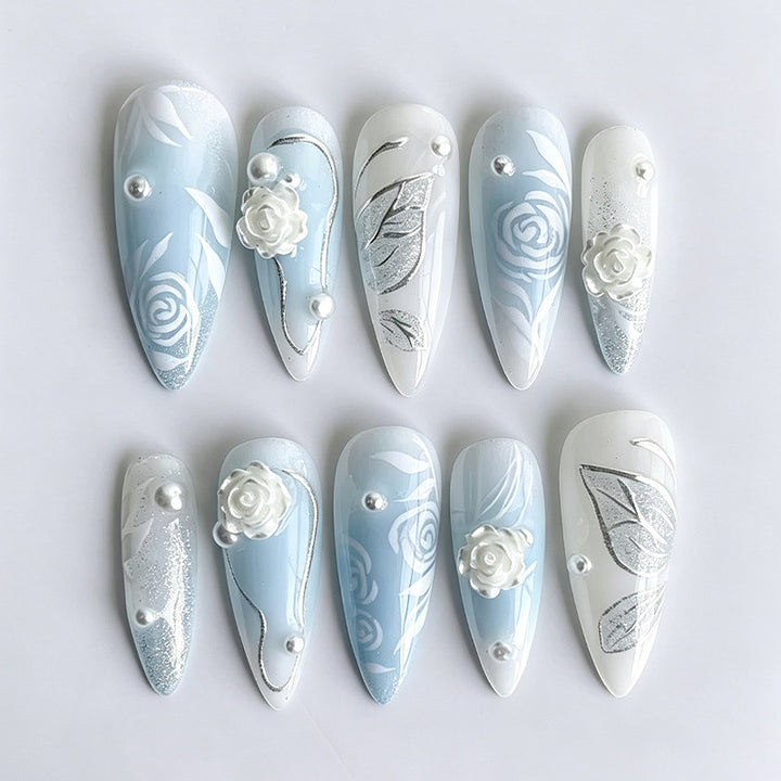 Artificial nail set with elegant floral motifs and glitter effects Stornfield