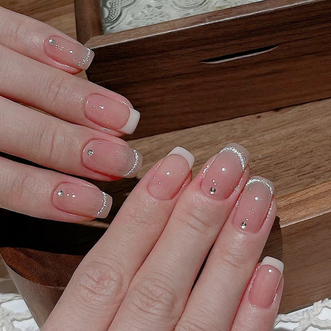 Glamorous artificial nails with filigree rhinestone details Stornfield