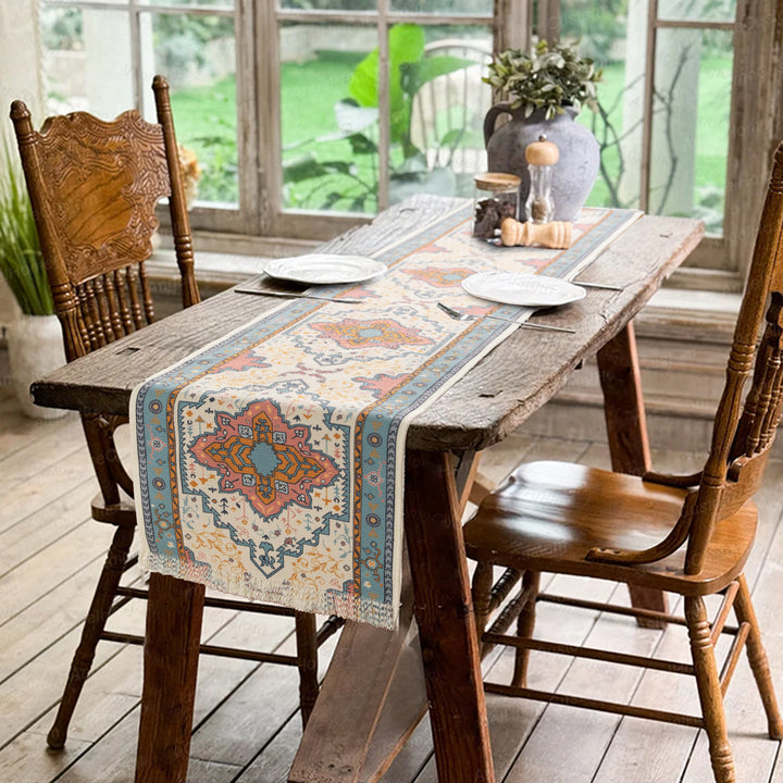 Woven table runner made of cotton blend with oriental medallion pattern and fringes Stornfield
