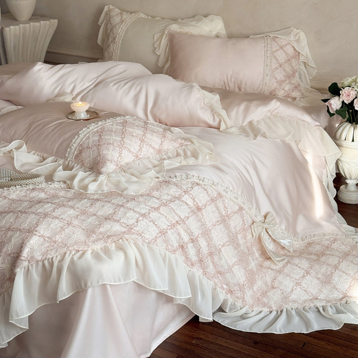 Romantic satin bedding set with ruffle, embroidered lace insert and bow appliqué
