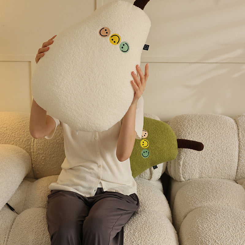 Pillow in pear shape made of teddy fleece with applied smileys