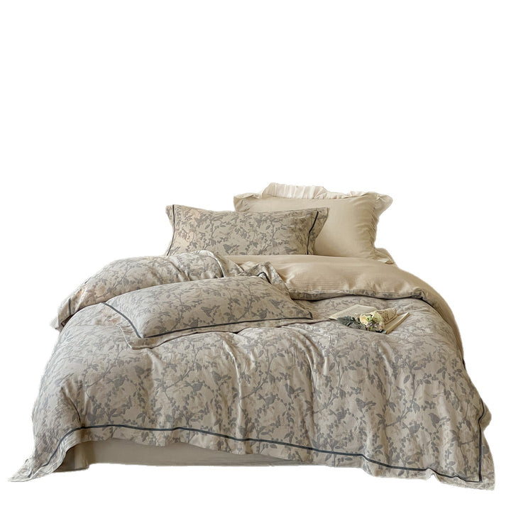 Linen-look duvet cover set with delicate branch print, fine piping and throw