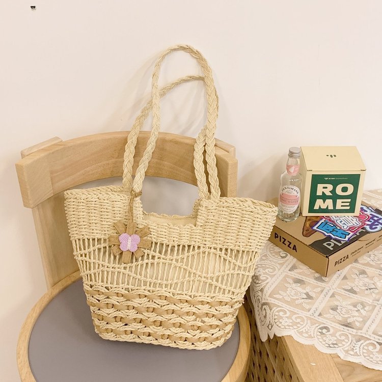 Handwoven beach bag with floral accents Stornfield