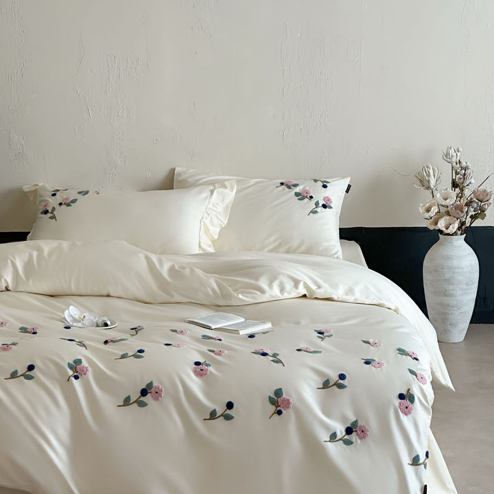 Luxurious satin bedding set with blue flower embroidery