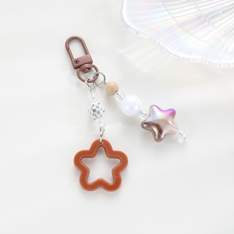 Playful keychain with floral and star motif Stornfield