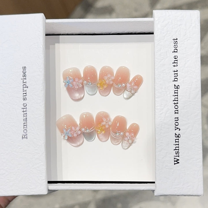 Romantic artificial nails with floral accents Stornfield