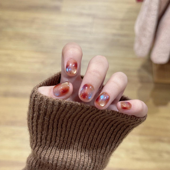 Artificial nails with shimmering galaxy patterns Stornfield