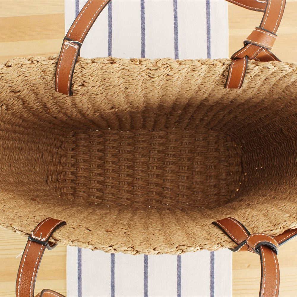 Beach bag made of handwoven natural material with sturdy leather straps Stornfield