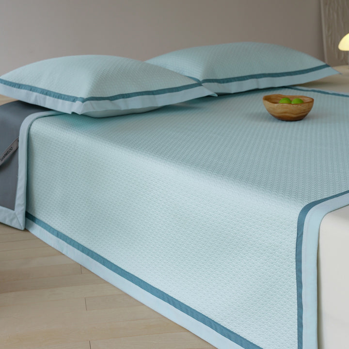 Quilted bedspread with textured waffle pattern and pillowcases