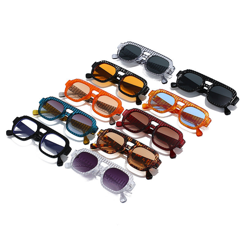 Ladies fashionable sunglasses in futuristic design with textured frame Stornfield