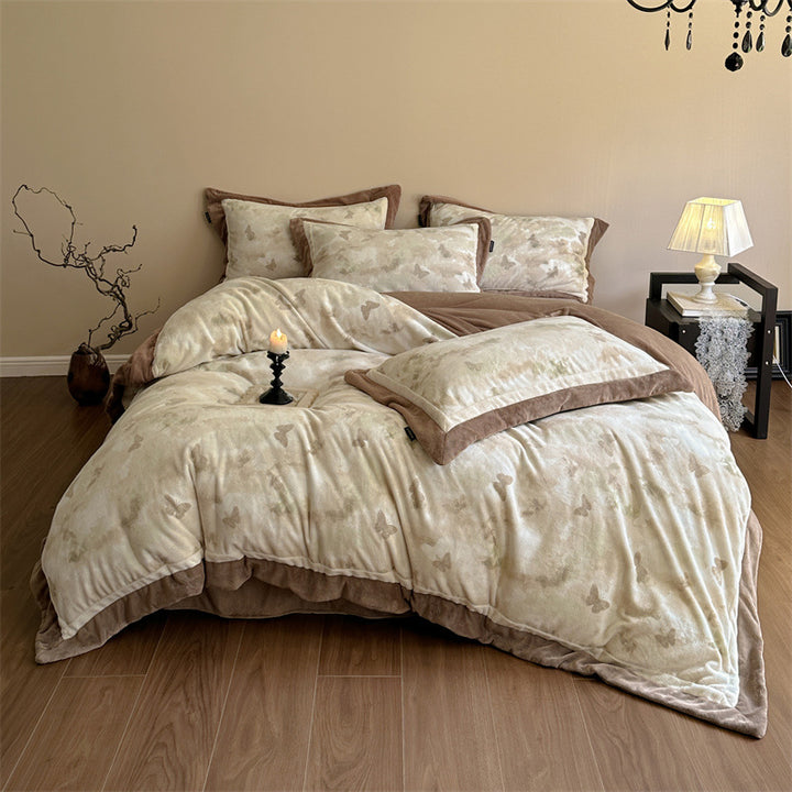 Luxurious quilted bedding set with velvet trim and floral branch motif