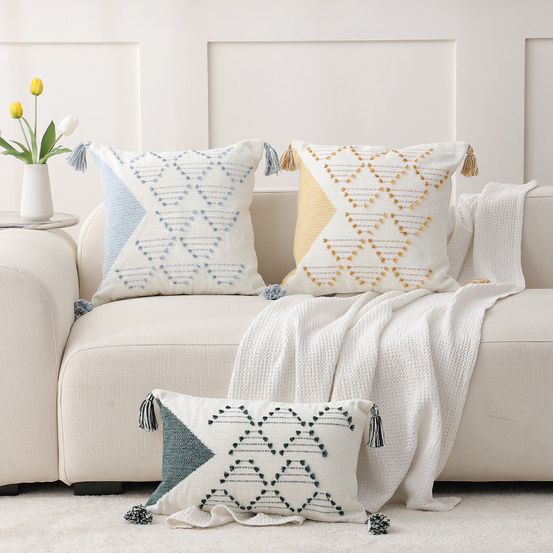 Decorative woven cushion cover with geometric tuft-relief and tassels Stornfield