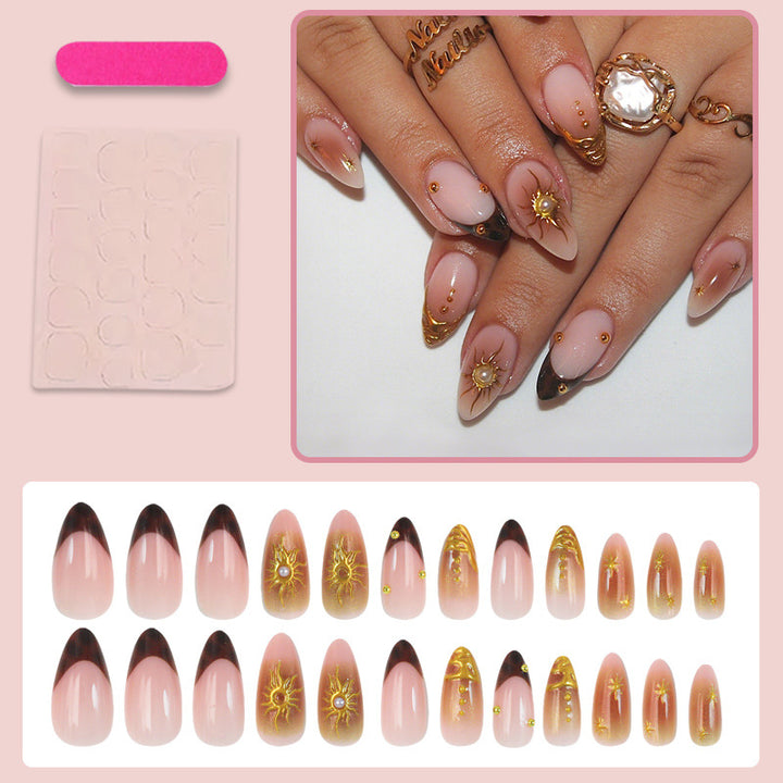 Artificial nail set with elegant gold pearls and delicate designs Stornfield
