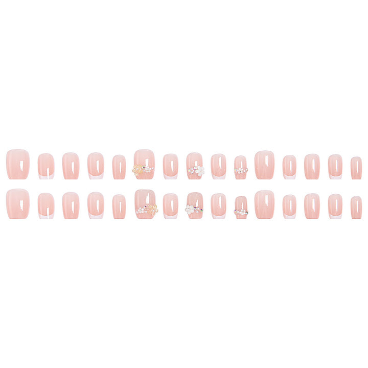 Nail set with elegant flower appliqués and exquisite glitter embellishments Stornfield