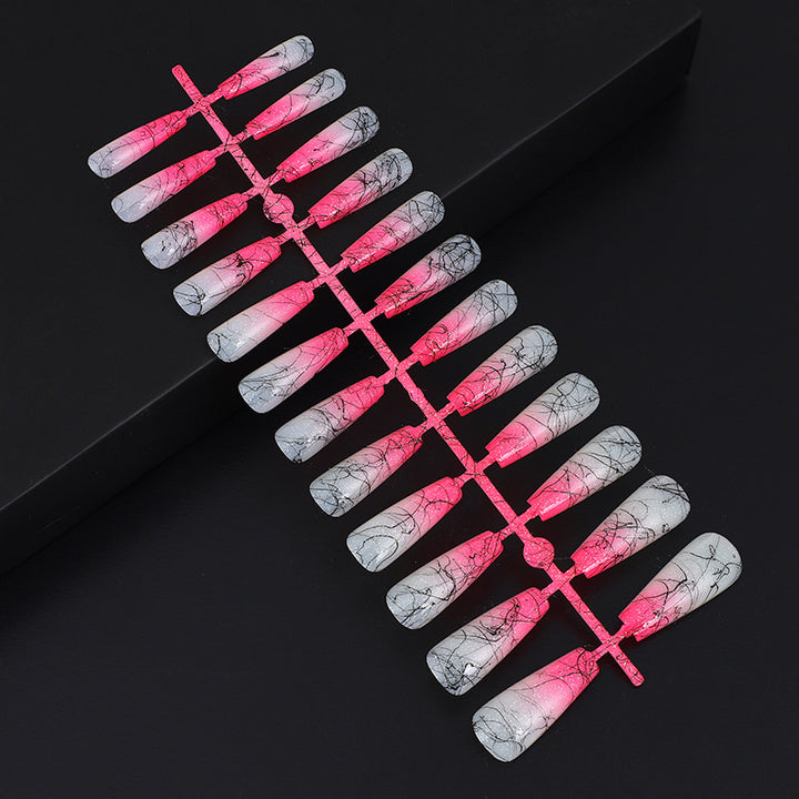 Artificial nails in modern ombre design with marbled accents Stornfield