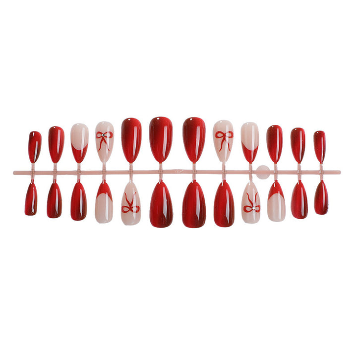 Designer artificial nails with elegant bow decoration Stornfield