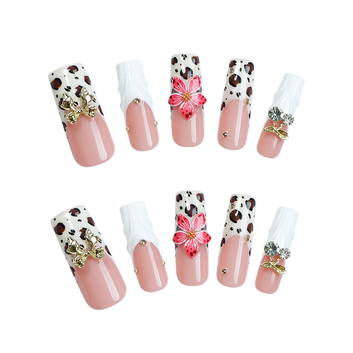Acrylic nail set with elegant leopard design and floral accents Stornfield