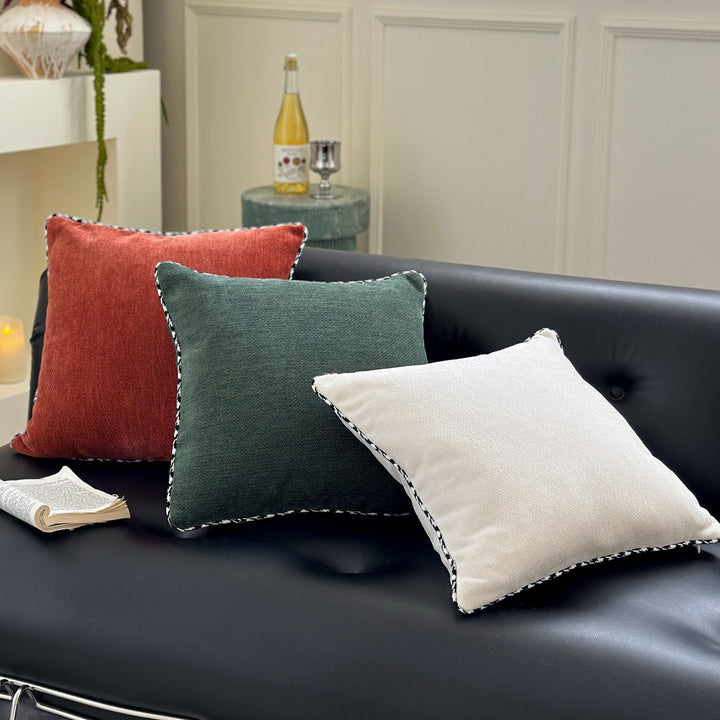 Decorative square decorative pillow made of soft velvet with contrasting piping