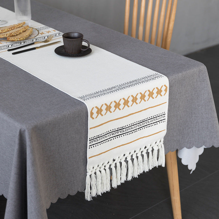 Woven Boho table runner made of cotton blend with decorative fringes and graphic stripe pattern Stornfield