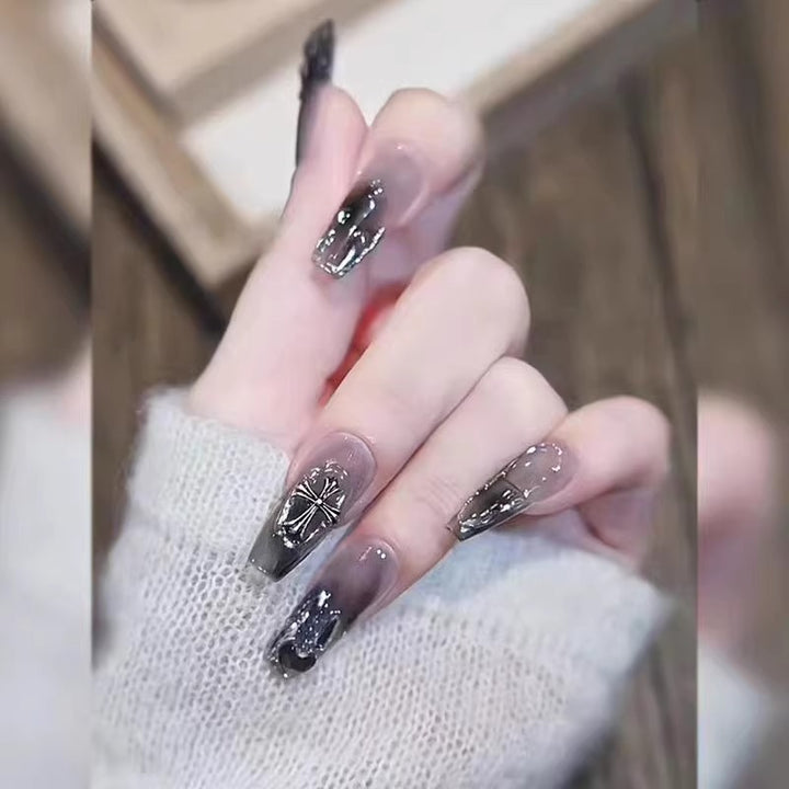 Glamorous artificial nails with heart design and glittering accents Stornfield