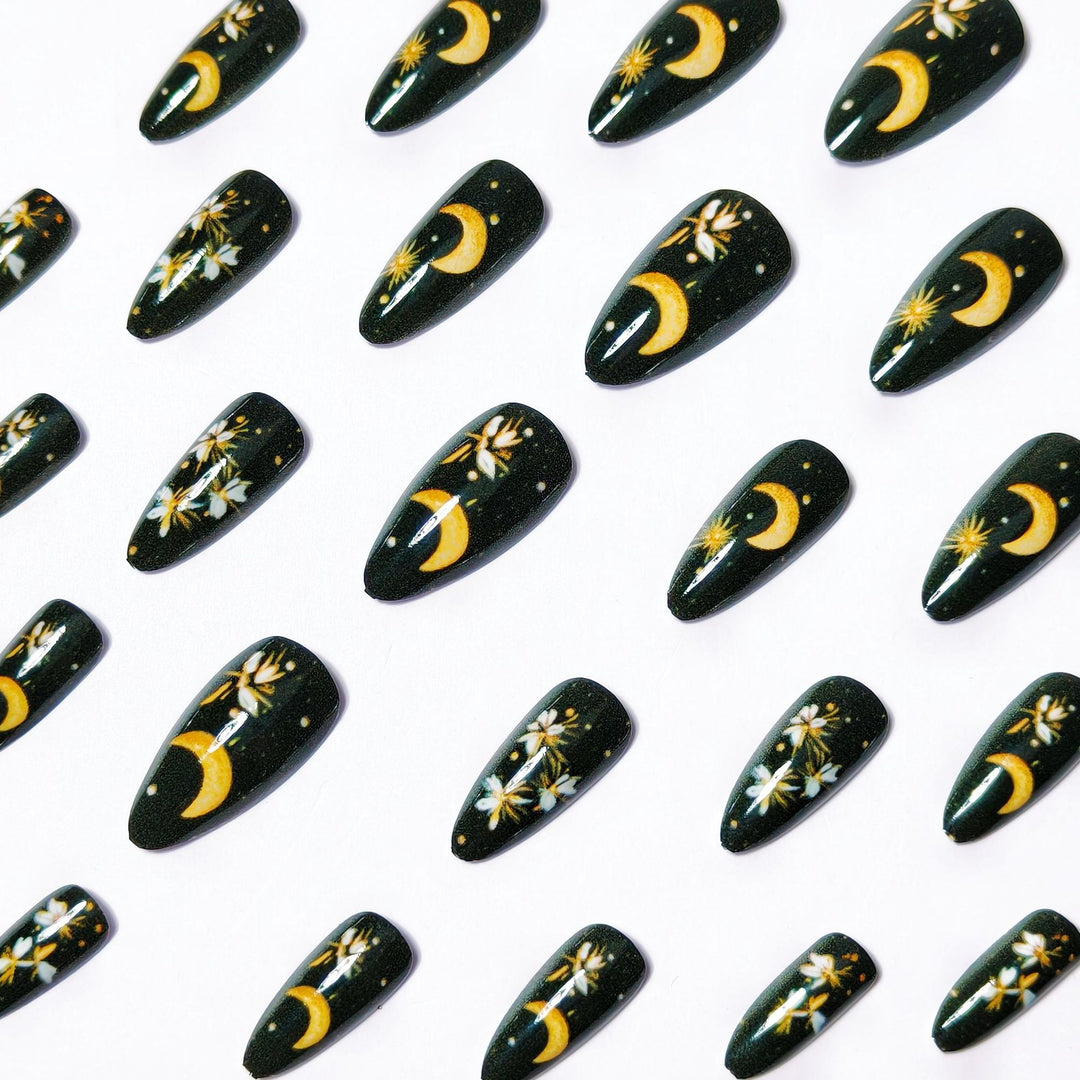 Glamorous artificial nails with moon and flower motifs Stornfield