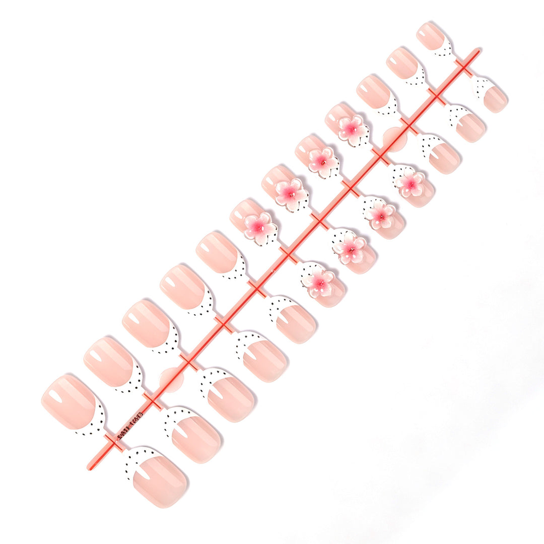 Artificial nail set with delicate floral designs and elegant accents Stornfield