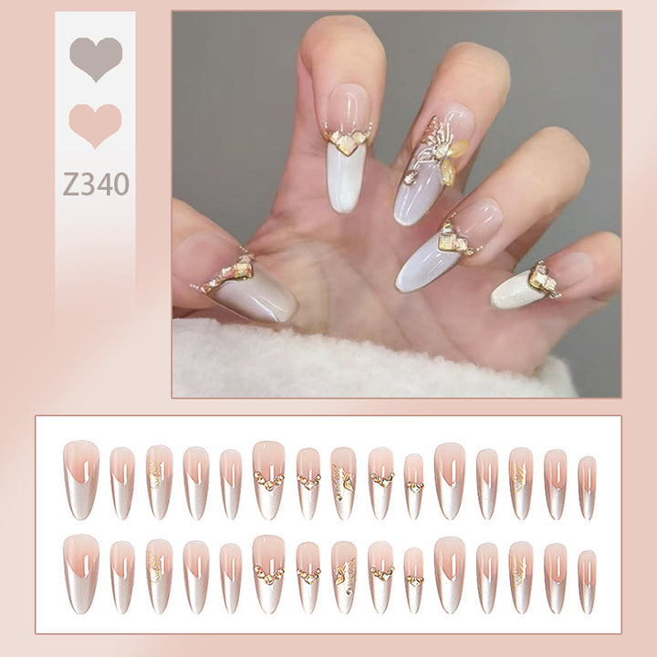 Glamorous art nails with elegant golden details Stornfield