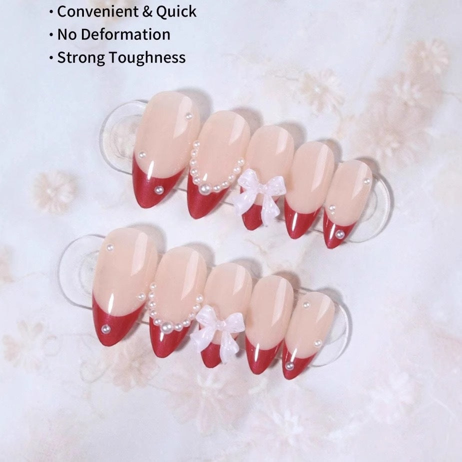 Artificial nail set with glamorous rhinestone and bow decorations Stornfield